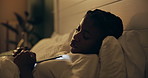 Night, tired and black woman with phone on bed for online chat, communication and networking. Sleeping, home and exhausted person on smartphone for social media, website and internet news in bedroom