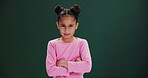 Angry, face and girl with arms crossed in studio with disappointment in tantrum or conflict. Frustrated, kid and emoji of upset child with mad, anger and negative mood in dark background or mockup