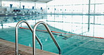 Swimming, pool and fitness with race lines, rail and gym for practice for competition as athletes for training or exercise. Aquatic sports, workout and wellness in underwater for cardio or activity