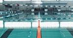 Indoor, empty swimming pool and lane rope for competition or fitness with exercise for health. Calm, liquid and divider for aquatic training with professional sport, reflection and racing in centre