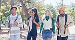 Group, students and outdoor with diversity, walking and backpacks on campus or university. People, friends and happy, talking and education for exam, scholarship and learning in college or school