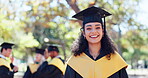 University, face and happy woman with graduation cap on campus for education, celebration or degree. Bokeh, smile and portrait of student for achievement, satisfaction or academic growth at school