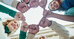 Hands, together and people fist bump in team building, mission collaboration or low angle of students. Group, support and cooperation with teamwork on project in community at college or university