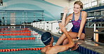 Swimmer, man and woman with high five, pool and swimming for training, competition and practice of sports. Water, athlete and person in performance, healthy and exercise for speed, workout or fitness