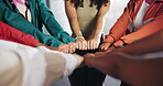 Hands, huddle and solidarity with group of people closeup for strength, support or unity from above. Circle, fist and trust with friends together for community, mission or team building closeup