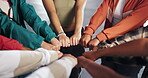 Hands, huddle and solidarity with group of friends closeup for strength, support or unity from above. Circle, fist and trust with people together for community, mission or team building closeup