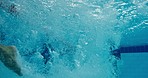 Underwater, dive and male athlete for pool exercise, training and cardio for practice. Stroke, professional or start for competition or splash with movement, sports or workout for health and wellness