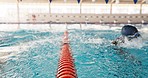 Pool, swimming and lane rope for training in water for fitness with exercise for workout. Athlete, stroke and divider for aquatic training with professional sport, reflection and racing in France