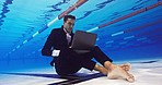 Business, man and working on laptop in pool, typing and drowning in work and deadlines. Oxygen bubbles, corporate employee and sitting under water, overworked and submerged and online company project