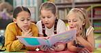 Children, reading book and learning on floor at school, literacy and knowledge for mind development. Girls, kids and storytelling for education, english and literature information on mat for language