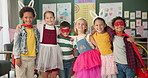 Happy children, friends and hug with costume in class for dress up or casual day at school together. Portrait of young kids with smile for halloween in cosplay outfit, hero or fairy tale in room