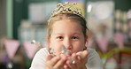 Crown, face or girl with confetti air, school or classroom party celebration in princess costume. Education, event or kid portrait with glitter magic for queen fantasy, dream or fairytale assignment