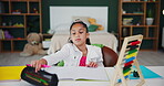 Girl, home and homework with book and pen in bedroom, child and student with abacus for counting or mathematics studying. Childhood, development and growth or school assessment, workbook or education