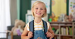 Happy, face and child in classroom for education, learning and ready for morning kindergarten. Smile, school and portrait of girl or student with knowledge, studying and pride for academic lesson