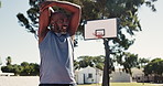 Fitness, stretching and training with black man on basketball court for competition, game or practice. Exercise, sports and warm up with athlete getting ready for start of performance outdoor