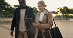 Partner, people and walking with tablet outdoor for commuting to work, discussion and online schedule. Happy, coworker and smile with career chat, networking and communication at park in New York