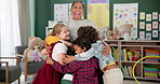 Happy woman, kids and hug teacher at kindergarten for learning, education or development in class together. Smile, group and children embrace educator in school for diversity, laugh or playing game