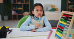 Homework, learning and girl with thinking by table for math, knowledge or problem solving in education. Abacus, student and writing on notebook in bedroom for studying, solution and child development