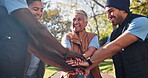 Volunteers, hands and pile for teamwork in outdoors, motivation and group for social responsibility. People, clapping and support for community service, non profit outreach and agreement in nature