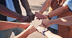 People, fist and hands in circle in outdoor for support or community program, solidarity and diversity with unity for synergy. Teamwork, huddle and together for volunteer for park or garden cleanup.