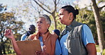 Women, volunteer and teamwork with clipboard in park for community service, support and planning. NGO, charity and mature manager with discussion in nature for brainstorming, idea and sustainability