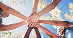 People, huddle and hands in air outdoor for success of community service or program, collaboration and teamwork. Diversity, unity and applause to celebrate for development, social justice and ngo.