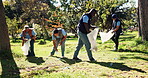 People, volunteers and cleaning park, garbage and bottles for recycling, earth day and pollution for safe environment. Team, community and plastic bag for litter, waste and project  for eco friendly