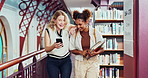 College, phone and students laughing in library for social media, meme and assignment or project. Girls, smartphone and walking for university, knowledge and study with ebook, app or education video