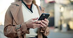 Road, smartphone and hands of woman scroll in social media, typing and waiting for transport. Female journalist, browse and mobile conversation with cellphone, network and commute to job in morning