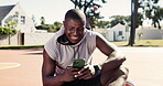 Male athlete, smile and phone in typing, scrolling or online for web, entertainment and social media. African man, tech and sports news in outdoor on digital, betting and gaming on mobile for results