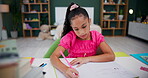 Girl, home and homework with book and pen in bedroom, child and student writing and studying or learning. Childhood, development and growth or school assessment, workbook or education for knowledge
