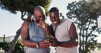 Phone, laughing and basketball players on court watching funny, goofy or comedy video together. Happy, fitness and African male athletes with comic joke on cellphone at outdoor sports training.