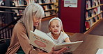 Girl, grandmother and book for reading in library, learning and study language or support for education. Mature woman, grandchild and teaching for mind development, english and literacy for project