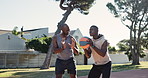 Basketball, father and men with training on court in park for workout, practice and help in sport. Black family, coaching and teaching with communication in nature for fitness, support and exercise