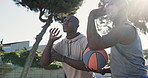 Basketball court, coaching and men with training in park for fitness, exercise and help in sport. Black family, low angle and communication with teaching in nature for practice, support and workout