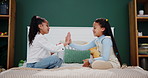 Children, learning and girl siblings on bed with hand game, fun and playful bonding in their home together. Family, love or kids with childhood palm match in bedroom with support, teaching or contest