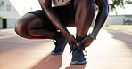 Sports, injury and hands of man on basketball court for ankle pain, massage or game. Athlete, legs and black person with hurt muscle for training, exercise or cardio workout in outdoor park of Miami