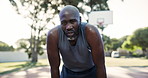 Sports, tired and black man on break at basketball court for outdoor training, game or workout. Fitness, exhausted and African male athlete breathing and sweating at practice, exercise or match.