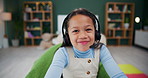 Headset, elearning and girl child in home in virtual class for growth, development or education. Laughing, technology and happy kid student at online school for knowledge with video call at house.