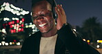 Black man, headphones and music with city, night and audio livestream or subscription. African guy, podcast or radio for streaming, listening and urban track with technology and dance for techno