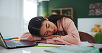 Student, girl and sleeping at desk for online education, e learning or studying fatigue with dream of university. Tired and exhausted person by computer with notebook for exam or scholarship at home