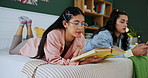 Friends, students and girls reading book in bedroom, studying and scroll on phone to relax in home. Women, bed and learning together for education, knowledge or college test preparation in university