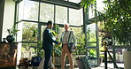 Man, greeting and handshake for welcome to hotel on travel business, assistance and luggage or suitcase for courtesy or professionalism. People, shaking hands and escort hospitality service for guest