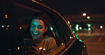 Woman, car window and happy on road with smartphone for social media, texting and networking in New York. Female passenger, taxi and smile at night with chat for online communication and traveling