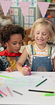 Boy, girl and drawing in class at kindergarten with paper in ideas, learning and happy with diversity. Children, friends and smile with talking, color pen and creativity for education at preschool