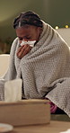 Sick, tissue and woman on sofa with blanket for allergies, infection and flu virus in living room. Healthcare, medical and person on couch sneeze for hayfever, influenza and sinus symptoms in home