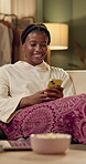 Night, home and black woman with smartphone on sofa for chat, online communication and social media. House, living room and couch for girl with mobile app for web meme, networking and text message