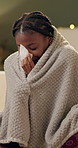 Sick, blanket and woman on sofa with tissue for allergies, infection and flu virus in living room. Healthcare, medical and person on couch sneeze for hayfever, influenza and sinus symptoms in home