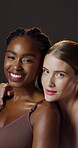 Women, diversity and skincare at studio in portrait in makeup for wellness, cosmetic and dark background. Female people, beauty and smile in confident, pride and lingerie in backdrop, closeup or pose