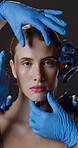 Woman, face and hands for plastic surgery or beauty procedure or inspection, transformation or clinic. Female person, fingers and studio as implant treatment or silicone, cosmetic or brown background